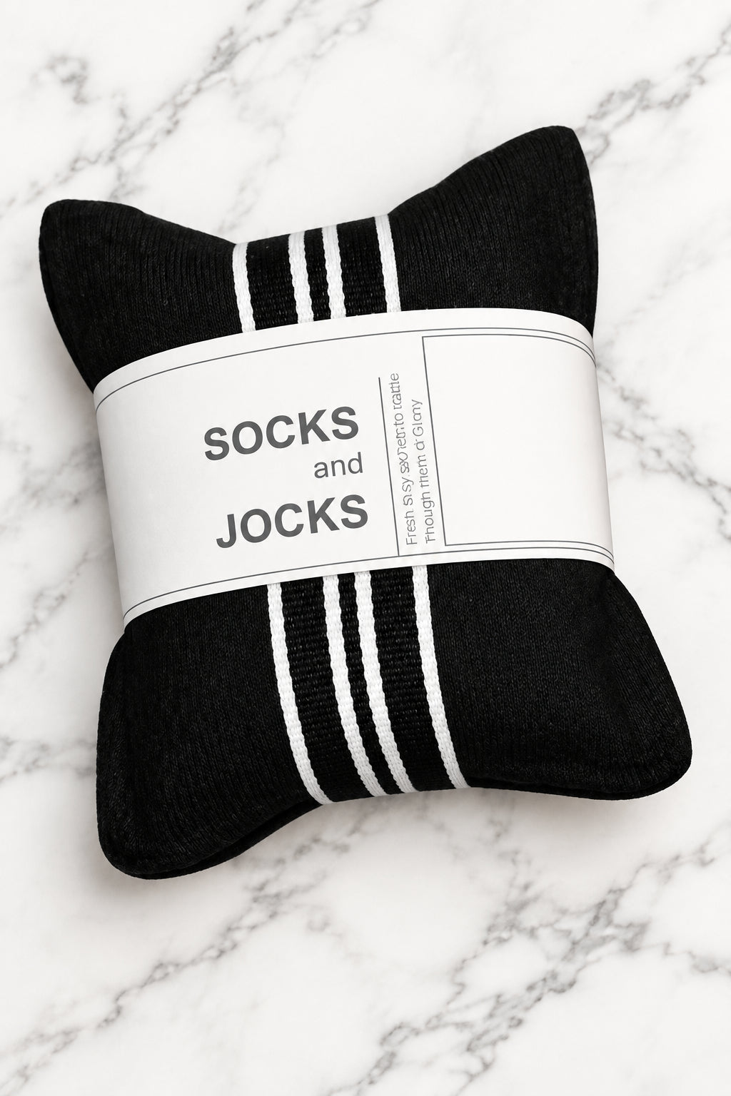 A black and white striped scented drawer sachet, wrapped in a white paper band that reads 'SOCKS and JOCKS'.