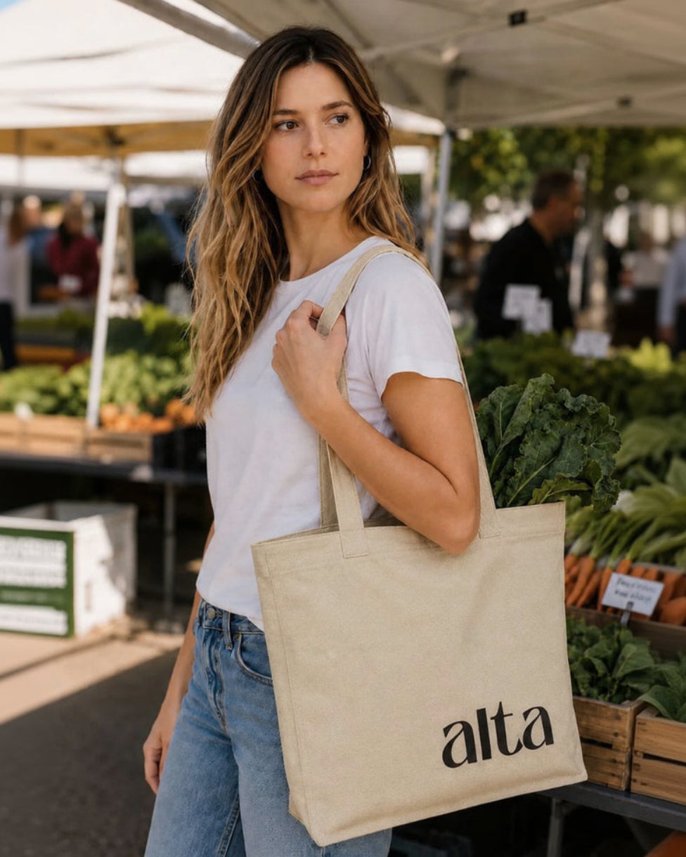 Alta Cotton Logo Shopping Tote Bag in use on female in jeans and tshirt